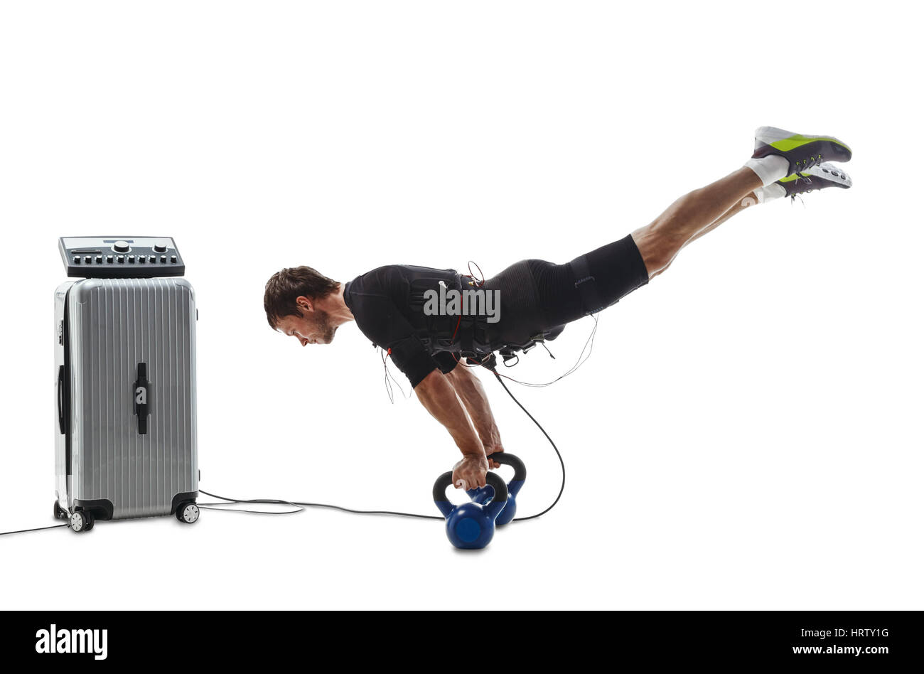 Fitness-Sportler in elektrische Muskelstimulation Anzug einen horizontalen  Handstand auf Hanteln zu tun. Isoliert auf weißem Hintergrund  Stockfotografie - Alamy