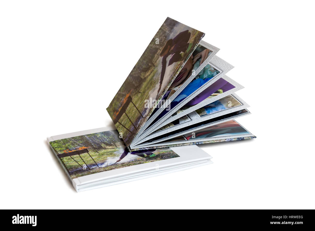 Zwei des Fotoalbums ist in einem schönen Fotobuch gestaltet. Auf weißem Hintergrund dargestellt. Stockfoto