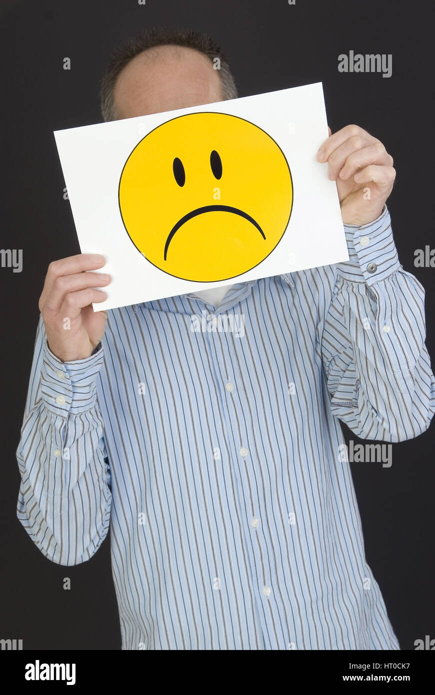 Mann Mit Traurigem Smileygesicht - Mann mit traurigen Smiley-Gesicht Stockfoto