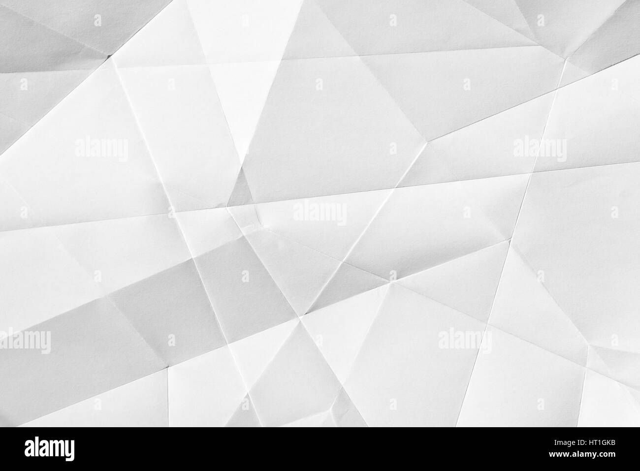 Weißes gefaltetes Blatt Papier zeigt eine abstrakte Textur-Design unter der hellen Streifen. Gut als Hintergrund verwenden Stockfoto