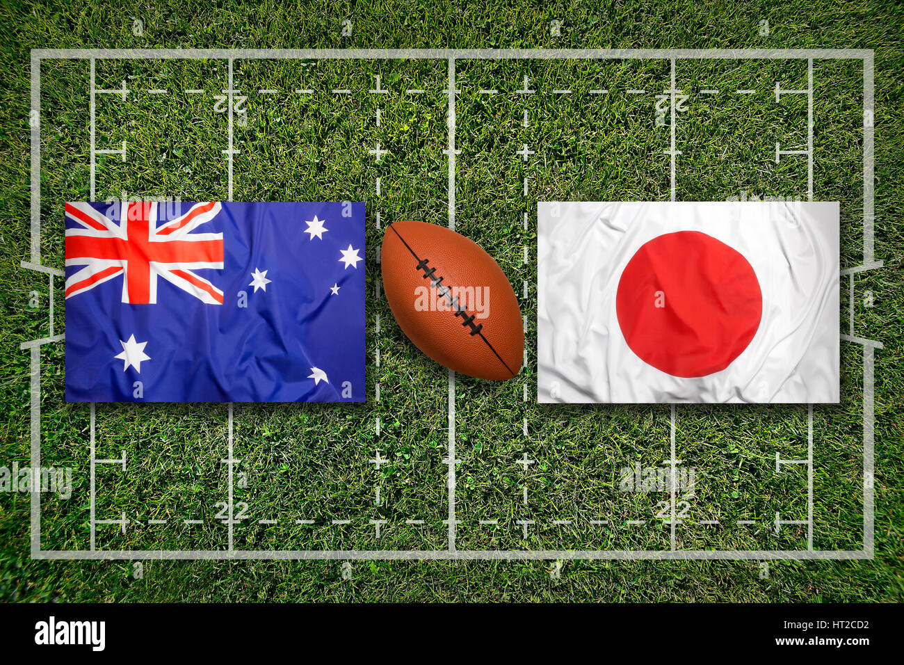 Australien vs Japan Flaggen auf grüne Rugby-Feld Stockfoto