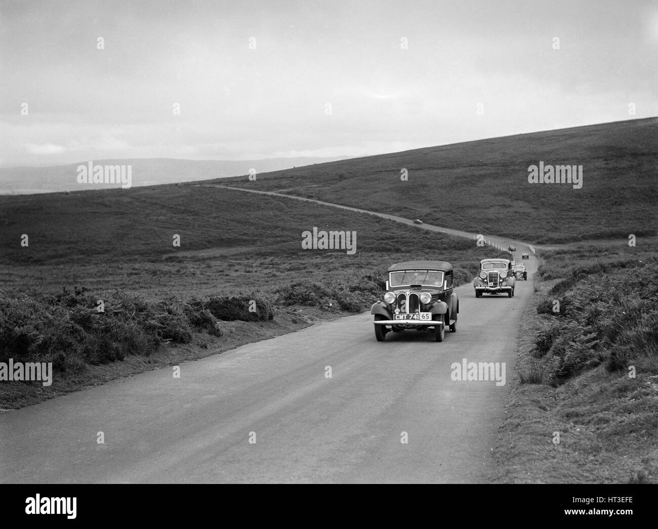 ALS Whiddington Frazer-Nash BMW vor RE Wrights Ford V8 bei der MCC Torquay Rallye Juli 1937. Künstler: Bill Brunell. Stockfoto