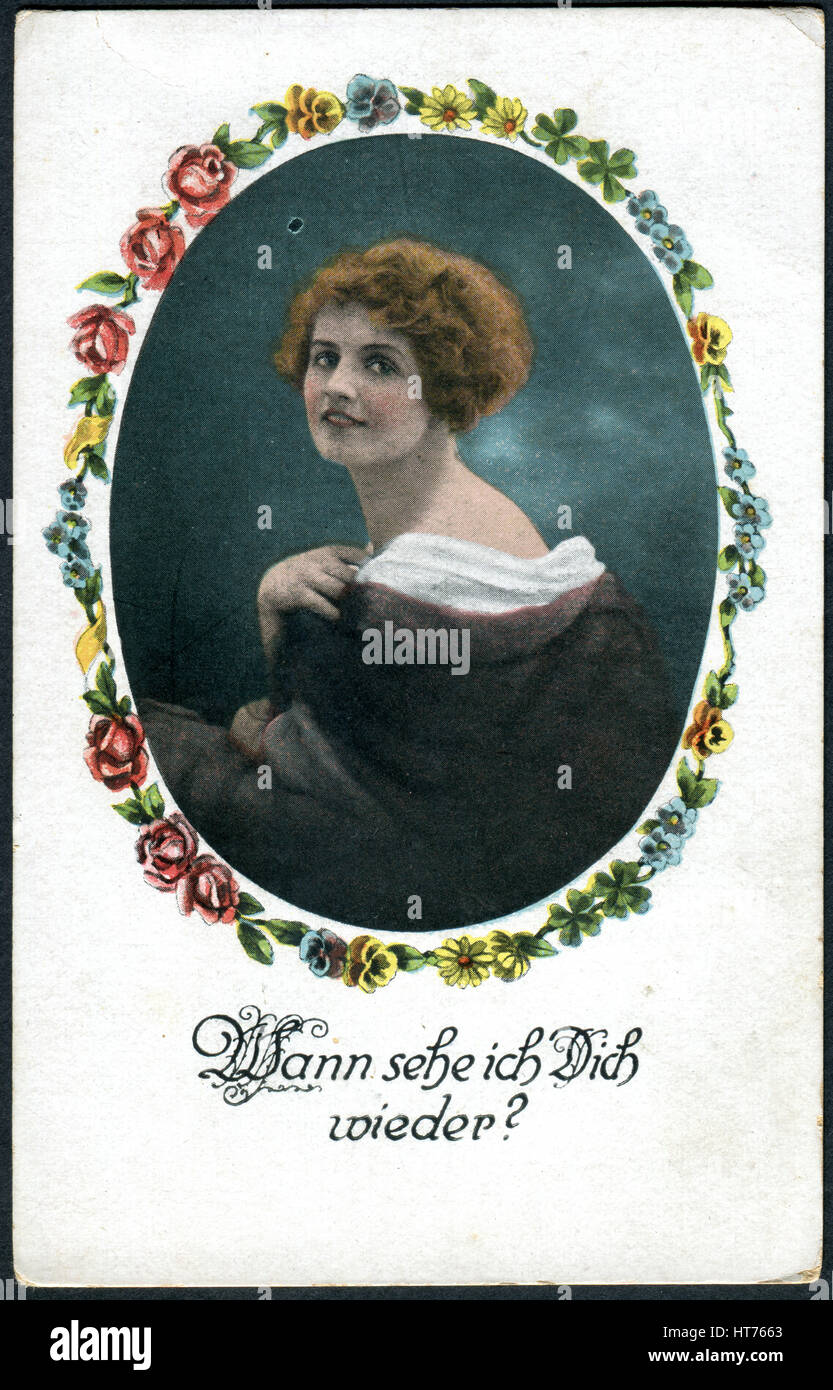 Eine Postkarte gedruckt in Deutschland, zeigt ein Porträt einer schönen Frau. Die Inschrift in deutscher Sprache: Wann sehe ich Sie wieder? Stockfoto