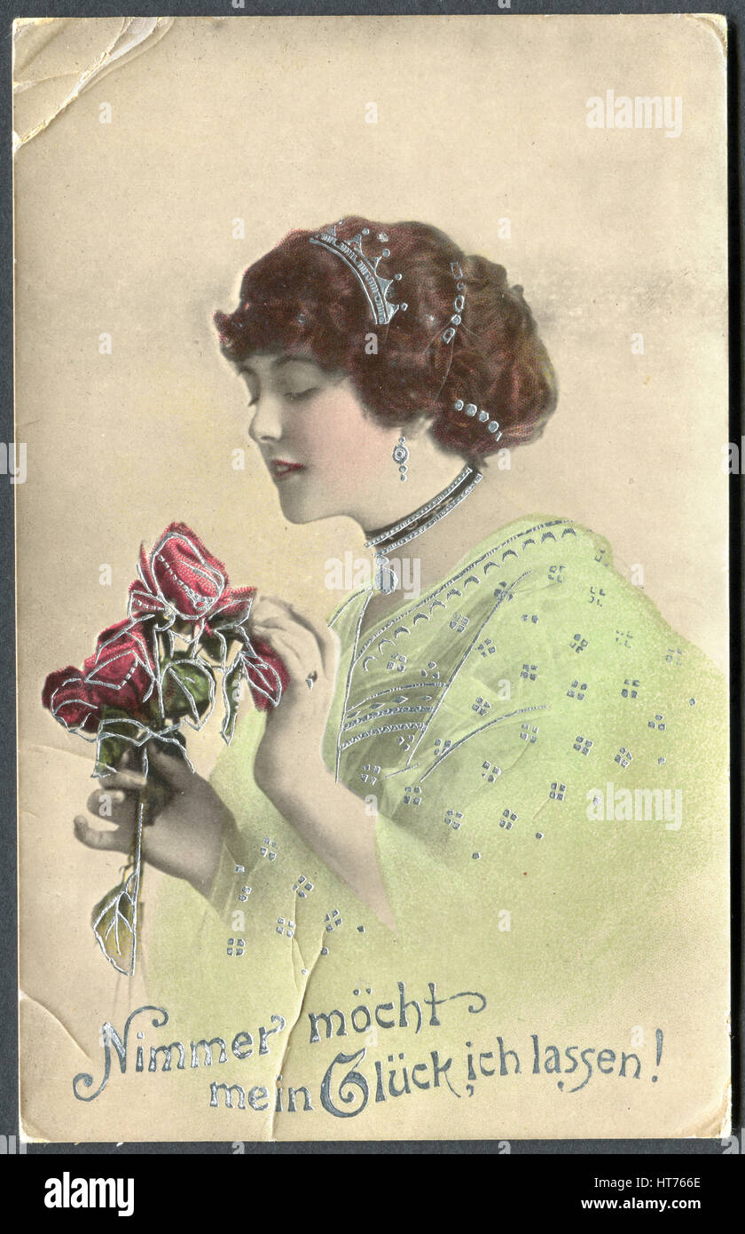 Eine Postkarte gedruckt in Deutschland, zeigt ein Porträt einer schönen Frau mit Rosen. Die Inschrift in deutscher Sprache: nie mehr mein Glück verlassen möchten! Stockfoto