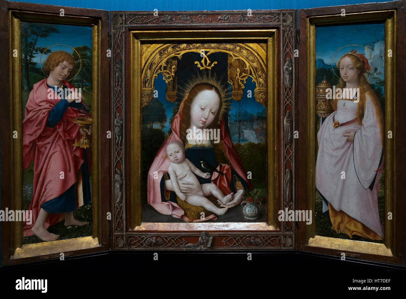 Triptychon mit Madonna mit Kind, der Evangelist Johannes und Maria Magdalena, von Jan Provoost, ca. 1520-5, Royal-Kunstgalerie, Museum Mauritshuis, Haag Stockfoto