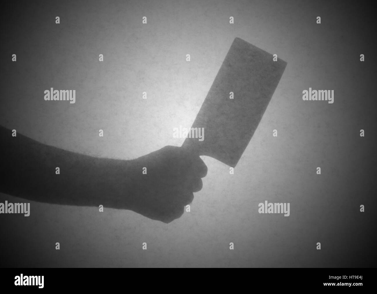 Silhouette hinter Transparentpapier - Spalter Messer Stockfoto