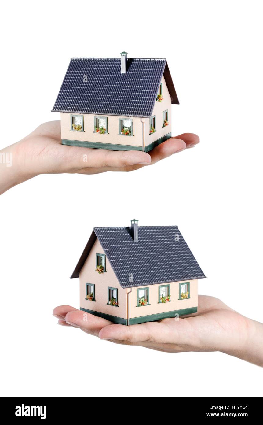 Hand, die Haus-Miniatur. Haushalt und Finanzen Wohnkonzept Stockfoto