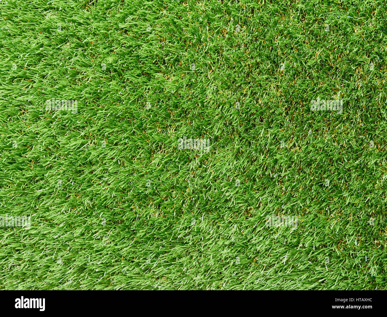 Vertikal, Top Luftaufnahme des grünen Astro Turf Rasen, abstrakte Rasen. Stockfoto