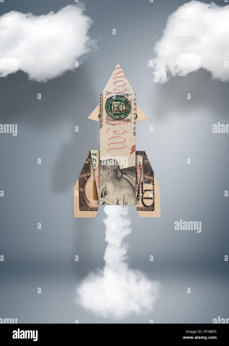 Starten Sie finanzielle Geschäftskonzept, Rakete aus Geld Stockfoto