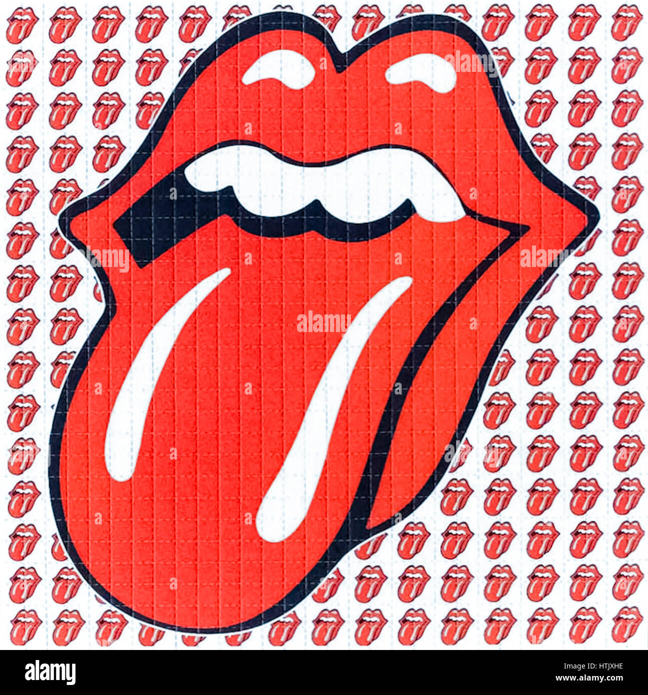 LSD Blotter mit den Rolling Stones Zunge und Lippen Logo von Jon Pasche. Löschpapier bestehen des Absorptionsmittels Löschpapier perforiert in kleine Abschnitte, die, wenn Sie getrennt werden die Einzeldosen. Das saugfähige Papier ist eingetaucht in eine gemessene Menge von LSD oder andere psychedelischen Drogen in flüssiger Form wie 2CBCB-NBOMe und die Registerkarten dann in versiegelten Tüten mit Angabe ihrer individuellen Stärke verkauft. Die Blotter Kunst oft verfügt über erkennbar und farbenfrohen Designs und Sammlerstücke aus eigenem Recht geworden. Stockfoto