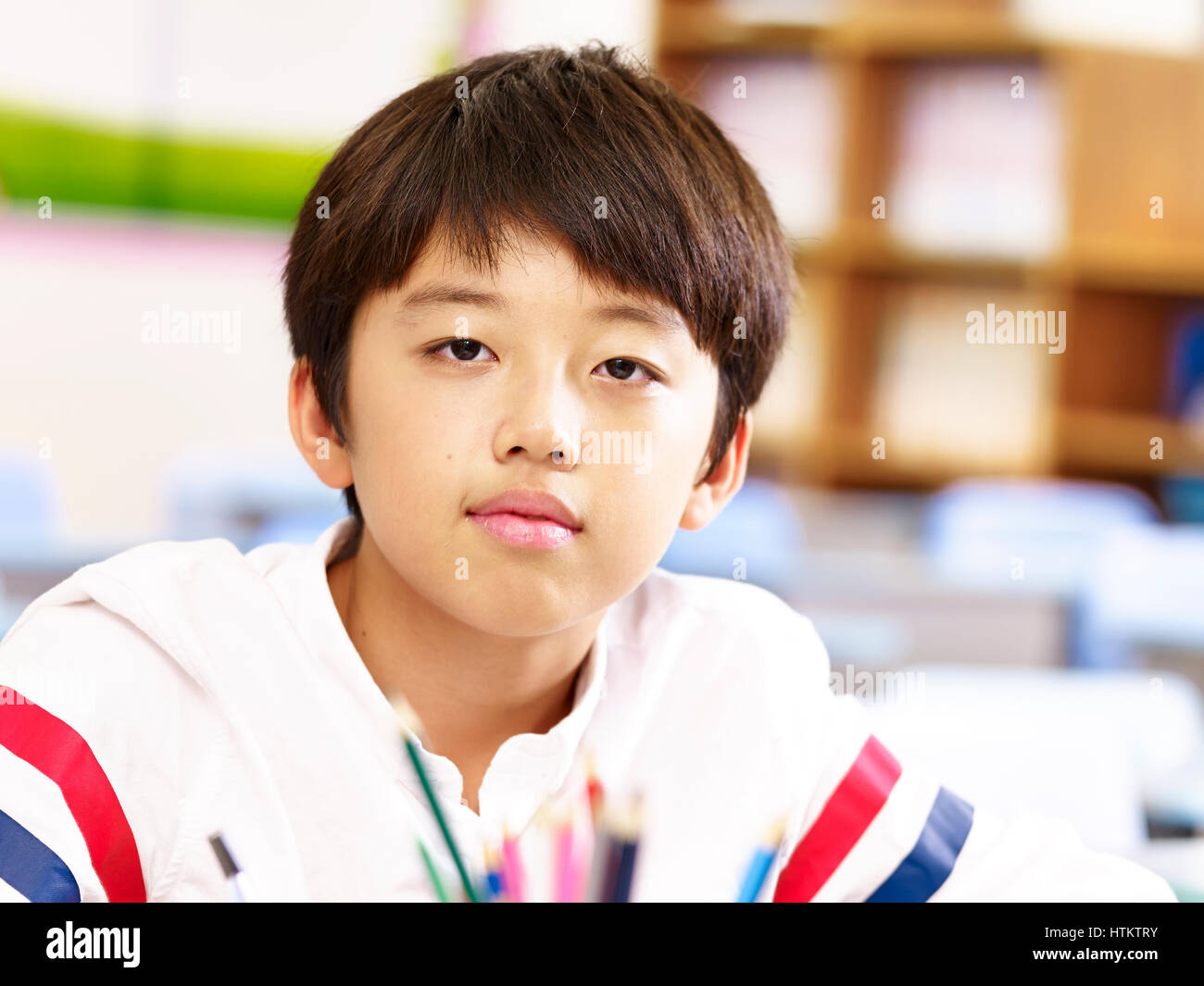 Porträt von 11 Jahre alten asiatischen elementare Schuljunge Stockfoto