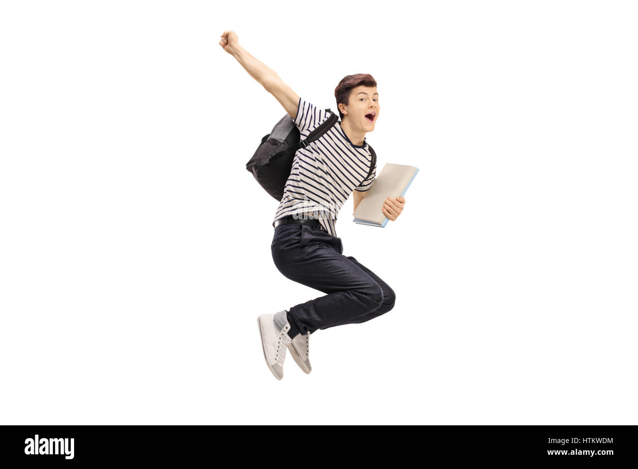 Überglücklich Teenager-Studentin springen und Gestikulieren Glück isoliert auf weißem Hintergrund Stockfoto