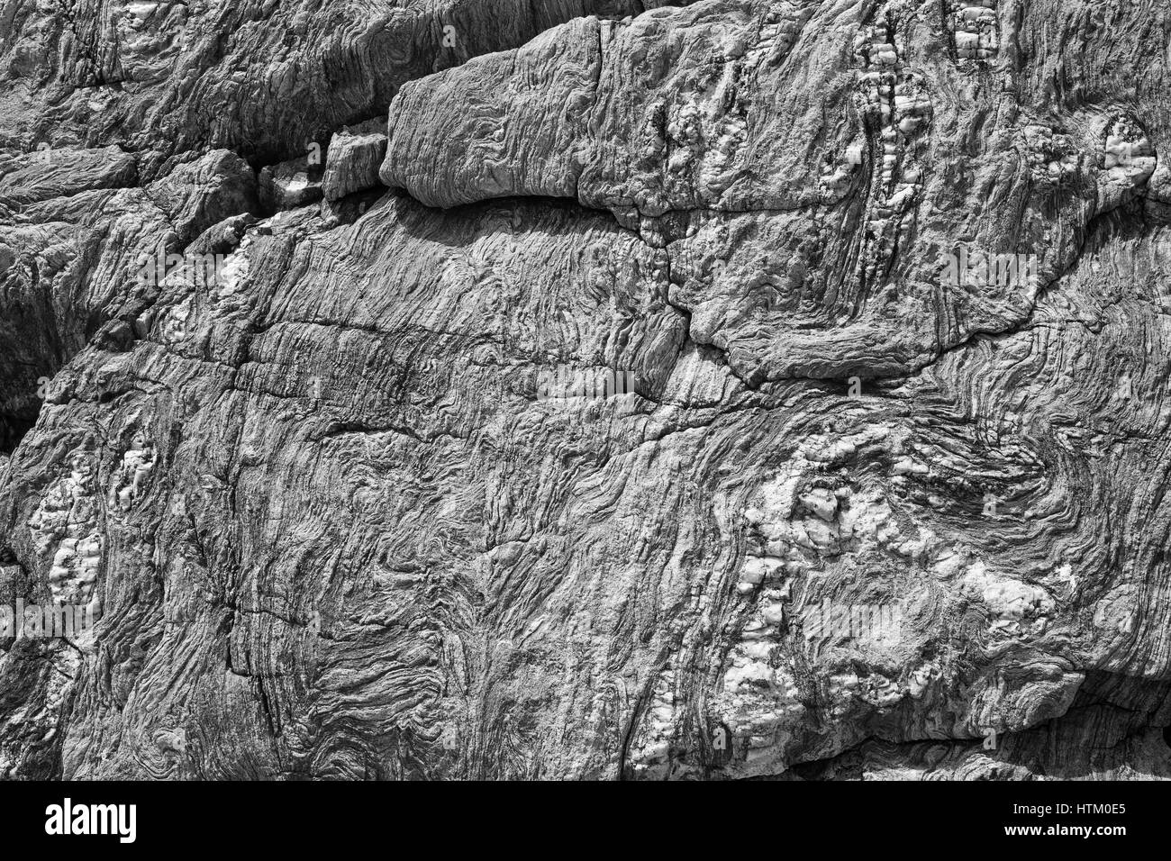 Abstrakte Stein Hintergrund - schwarz, grau, dunkelblau Steinstruktur - gefaltet Felsen Stockfoto