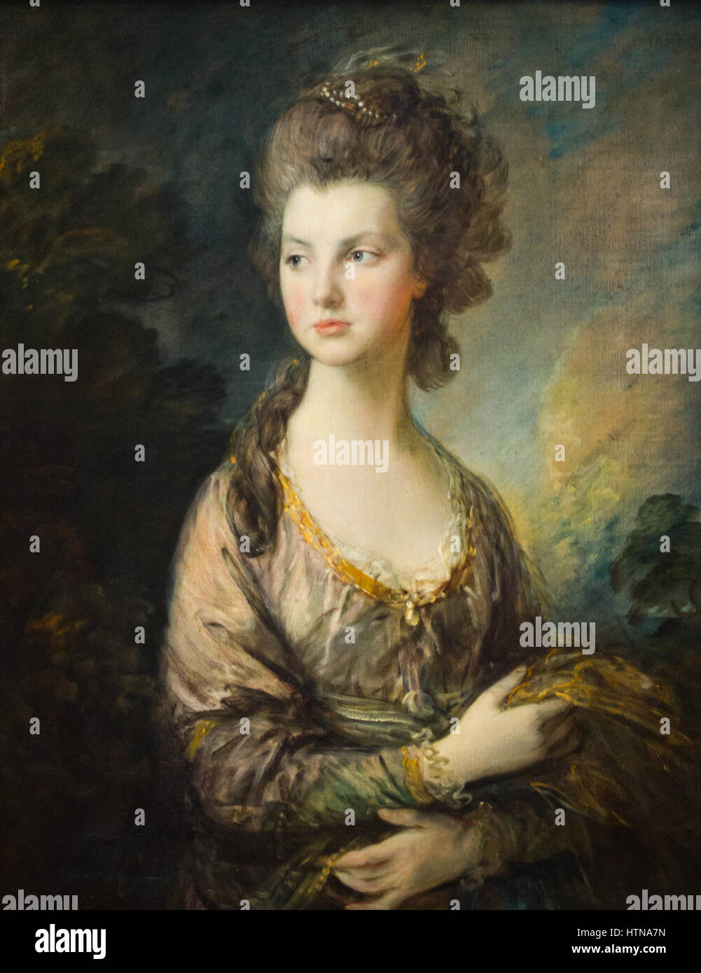 Dieses Porträt, „die Hure Mrs. Thomas Graham“, zeigt eine angesehene Frau des 18. Jahrhunderts. Das Gemälde reflektiert die Mode, die Ausgeglichenheit und den Status der Zeit und fängt den Adel des Themas mit eleganten Details und raffinierter Komposition ein. Stockfoto