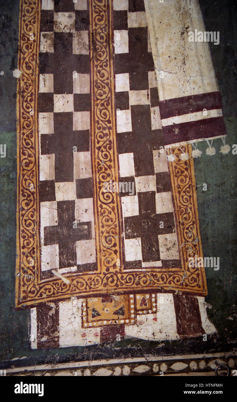 Die Gemälde in der Kirche des Theotokos Peribleptos in Ohrid zeigen Fresken im byzantinischen Stil, die religiöse Themen und Figuren darstellen. Diese Gemälde aus dem 12. Jahrhundert bieten einen Einblick in byzantinische Ikonographie und künstlerische Methoden und spiegeln die hingebungsvollen und theologischen Anliegen der Zeit durch lebendige Bilder und symbolische Details wider. Stockfoto