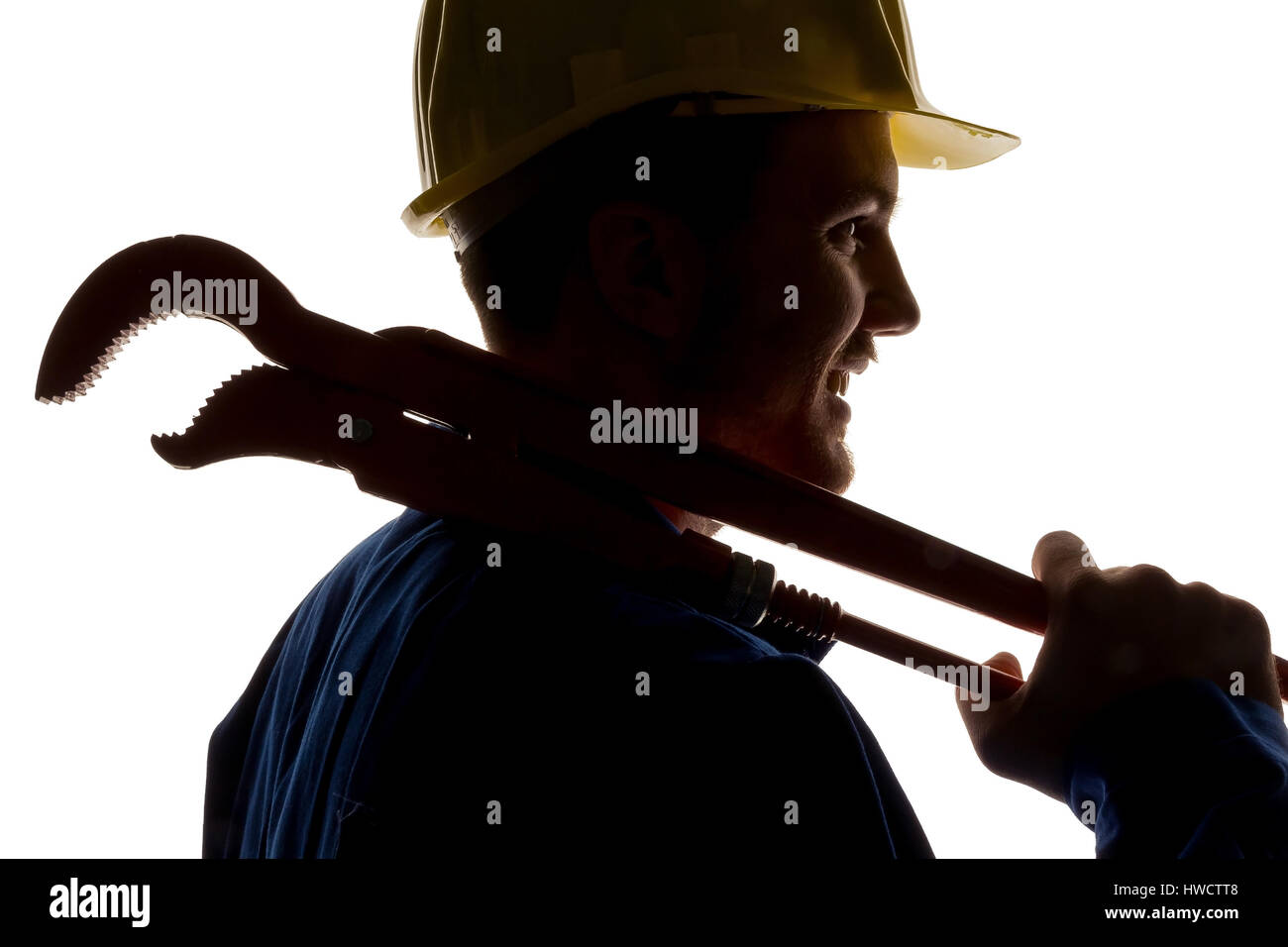 Ein Arbeiter in einem Industriekonzern (Handwerker) mit Werkzeugen in der Hand, Ein Arbeiter in Einem Gewerbebetrieb (Handwerker) Mit Werkzeug in der Hand Stockfoto