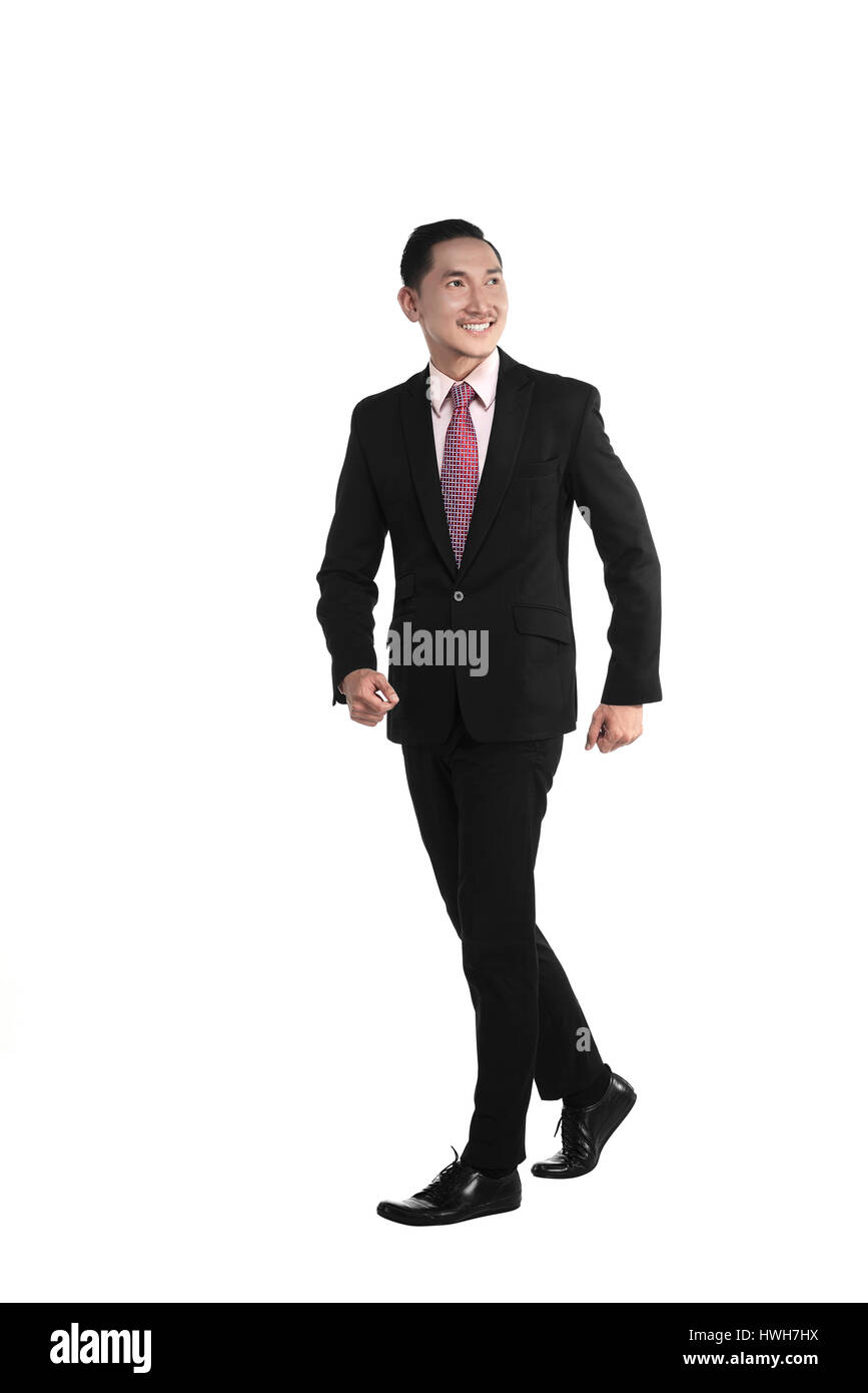 Asien-Geschäftsmann zu Fuß isoliert auf weißem Hintergrund Stockfoto