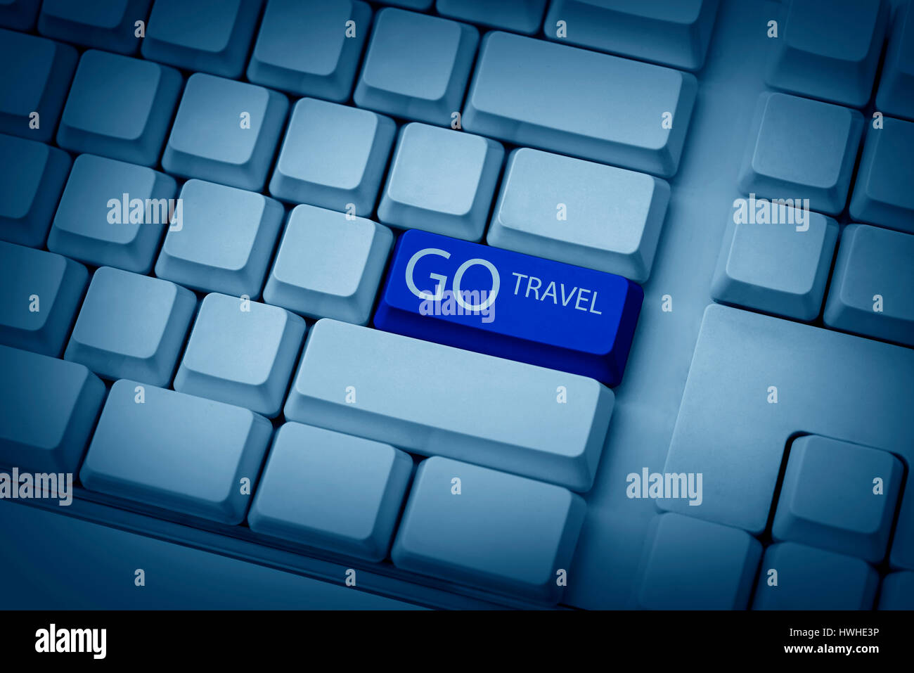 Leere Tastatur Tasten mit Go Travel eingeben Stockfoto