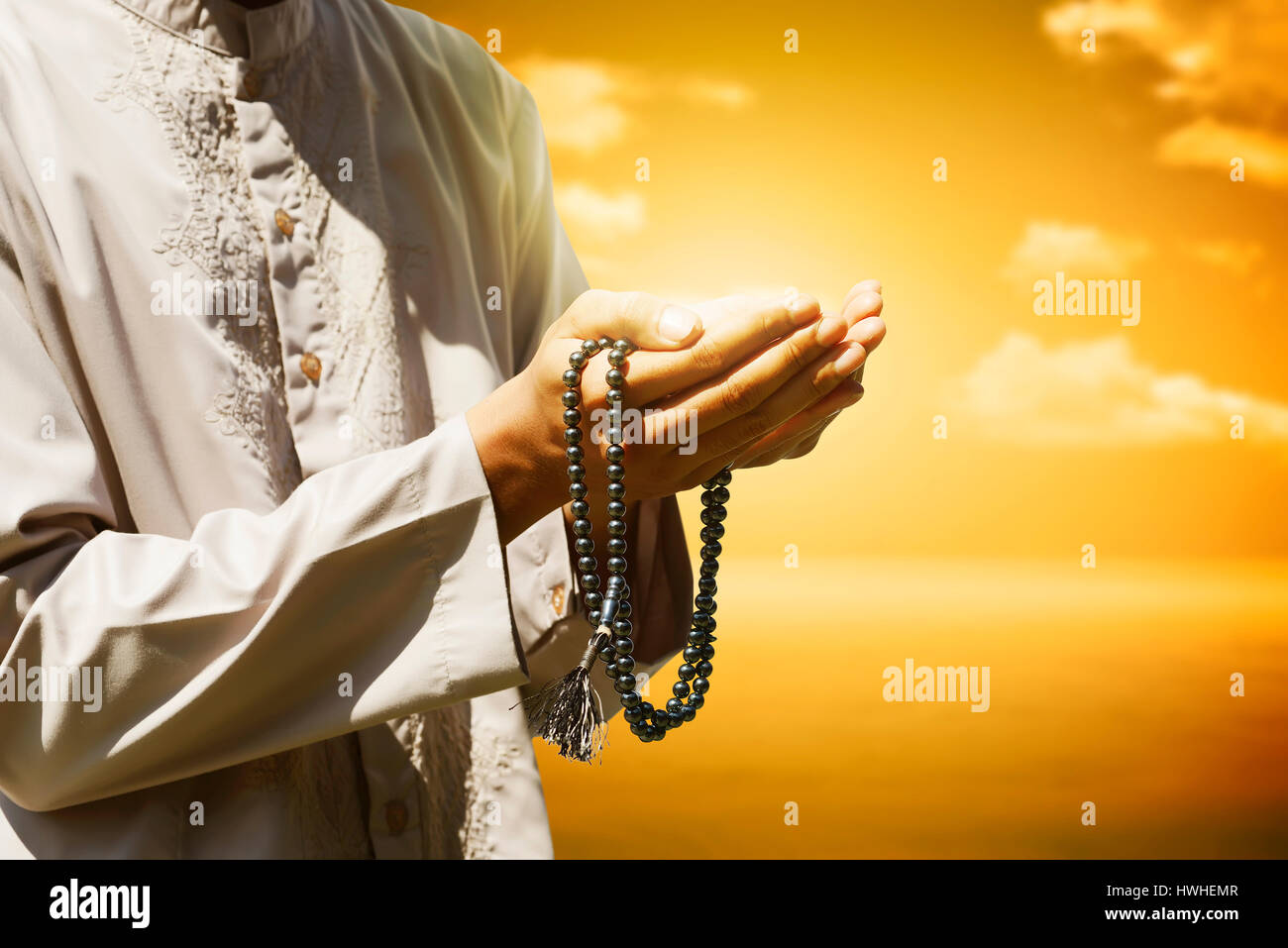 Hand der Muslime beten mit Sonnenuntergang Hintergrund Stockfoto