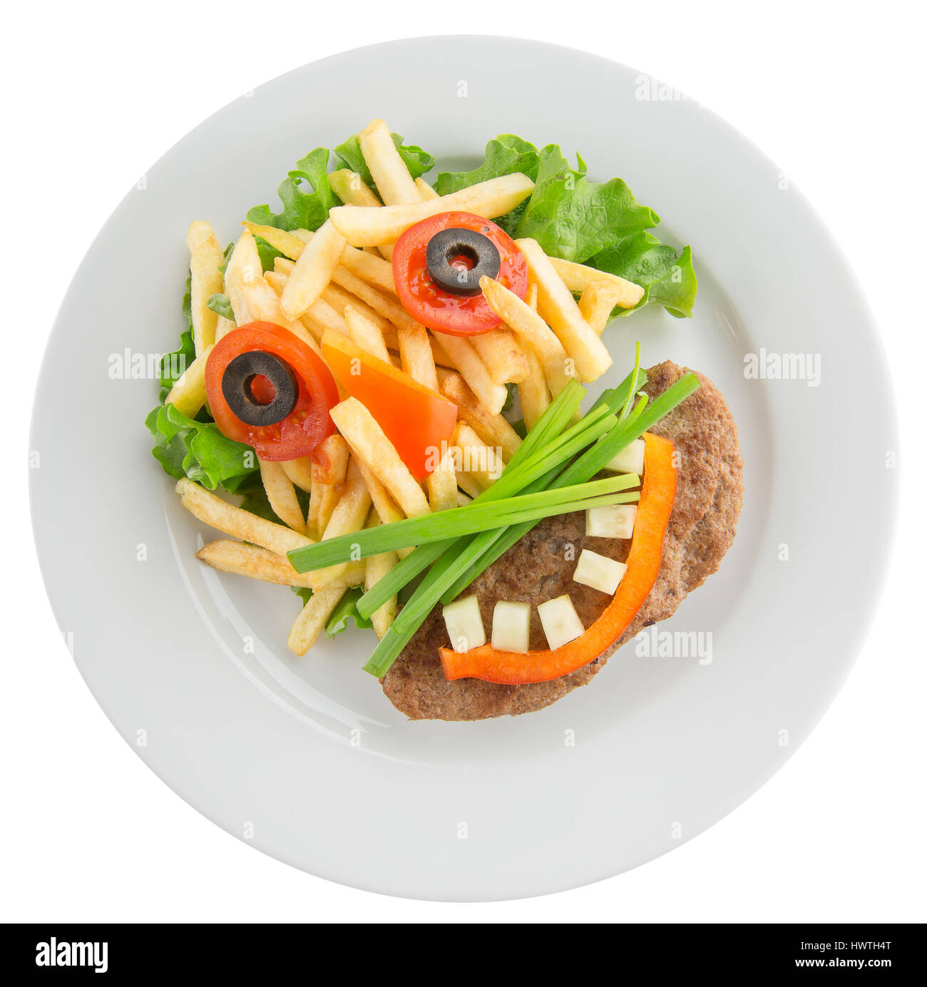 Kartoffelchips mit Gemüse in Form von lustigen Gesicht. Stockfoto
