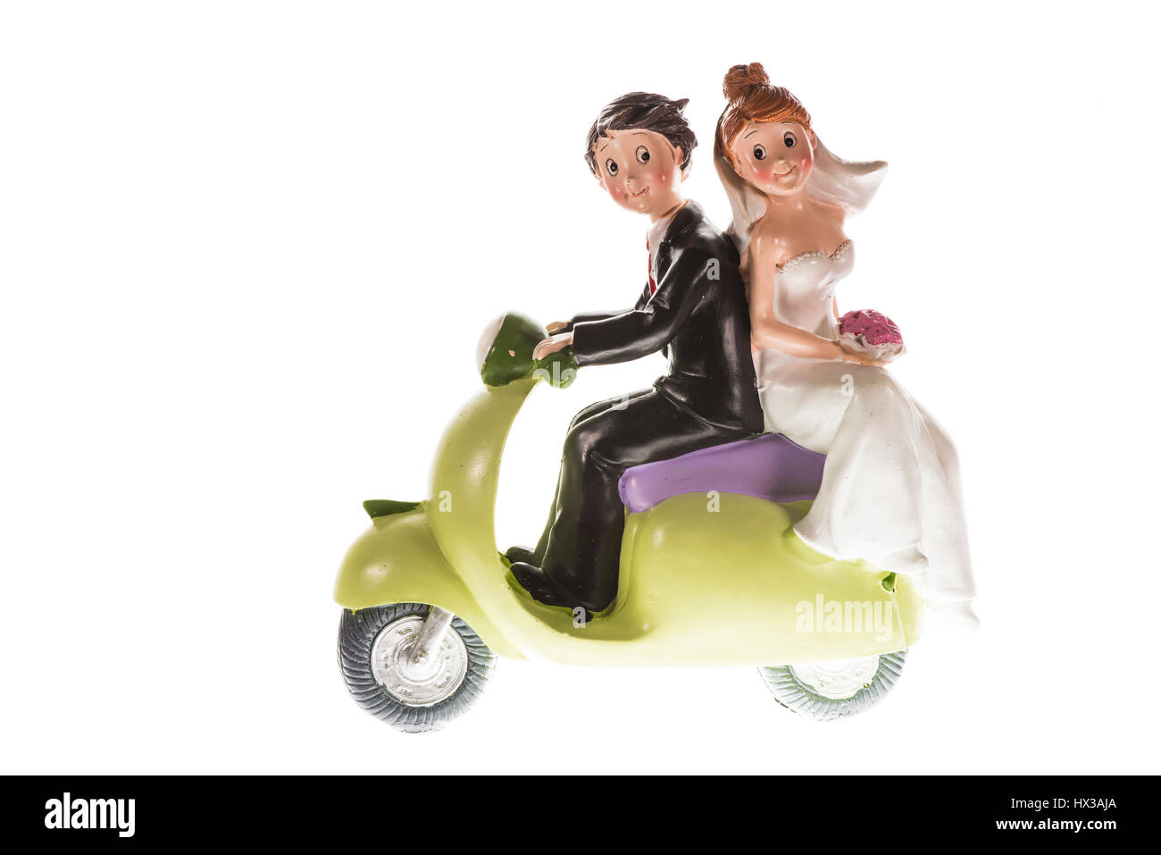 Figur der Bräutigam und die Braut, die mit dem Motorrad auf Hochzeit, Flitterwochen, Kuchen topper Stockfoto