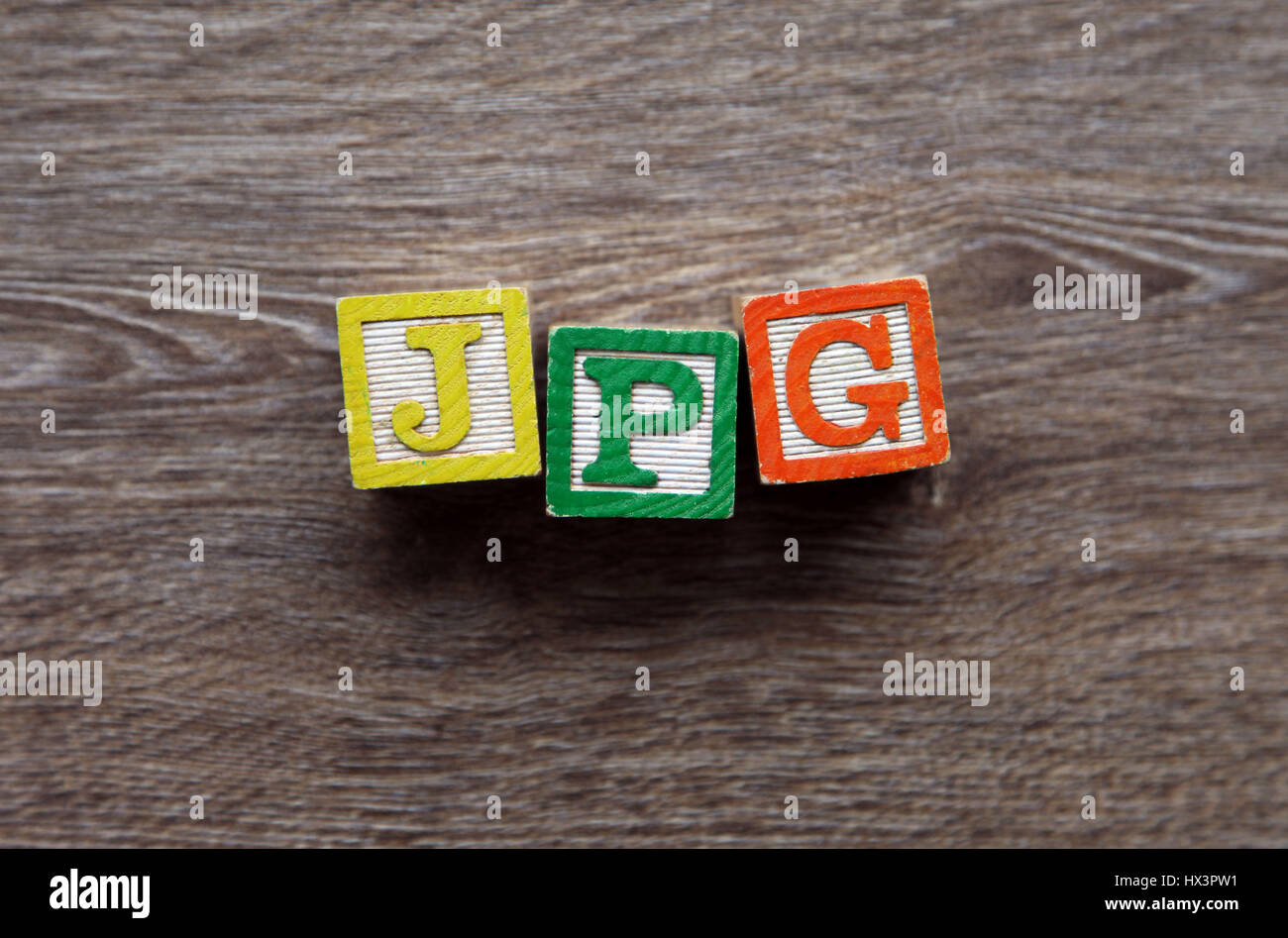Erweiterung JPG mit Holz-Block-Buchstaben-Alphabet geschrieben Stockfoto