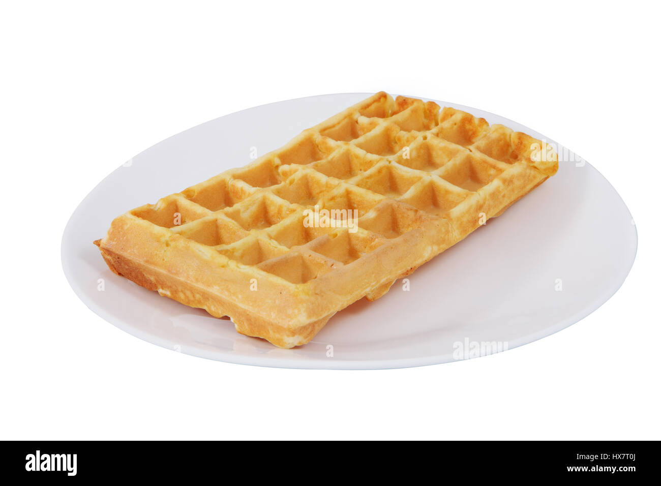 Auf einem weißen Teller ist eine belgische Waffel, isolierte Bild auf einem weißen Hintergrund, kein Körper. Stockfoto