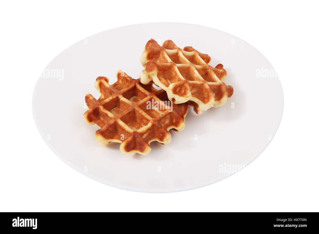 Auf einem weißen Teller ist ein zwei belgische Waffeln, isolierte Bild auf einem weißen Hintergrund, kein Körper. Weiche Waffeln Stockfoto