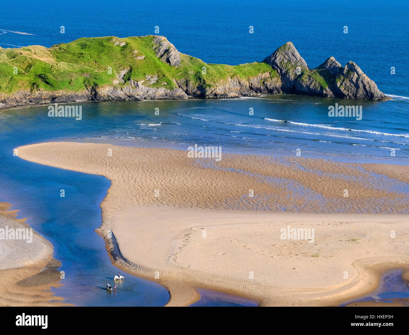 Reiter am Strand von Three Cliffs Bay auf der Halbinsel Gower, South Wales, UK Stockfoto