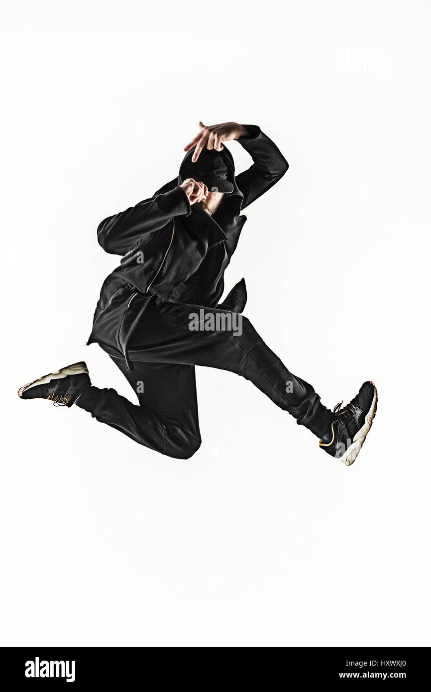 Die Silhouette von einem Hip-Hop-männliche Pause Tänzer tanzen auf weißem Hintergrund Stockfoto