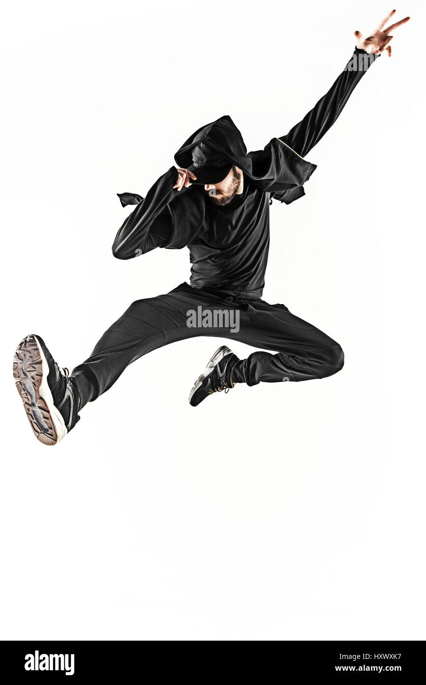 Die Silhouette von einem Hip-Hop-männliche Pause Tänzer tanzen auf weißem Hintergrund Stockfoto