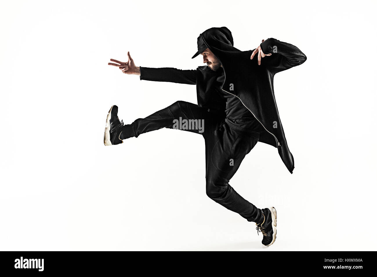 Die Silhouette von einem Hip-Hop-männliche Pause Tänzer tanzen auf weißem Hintergrund Stockfoto