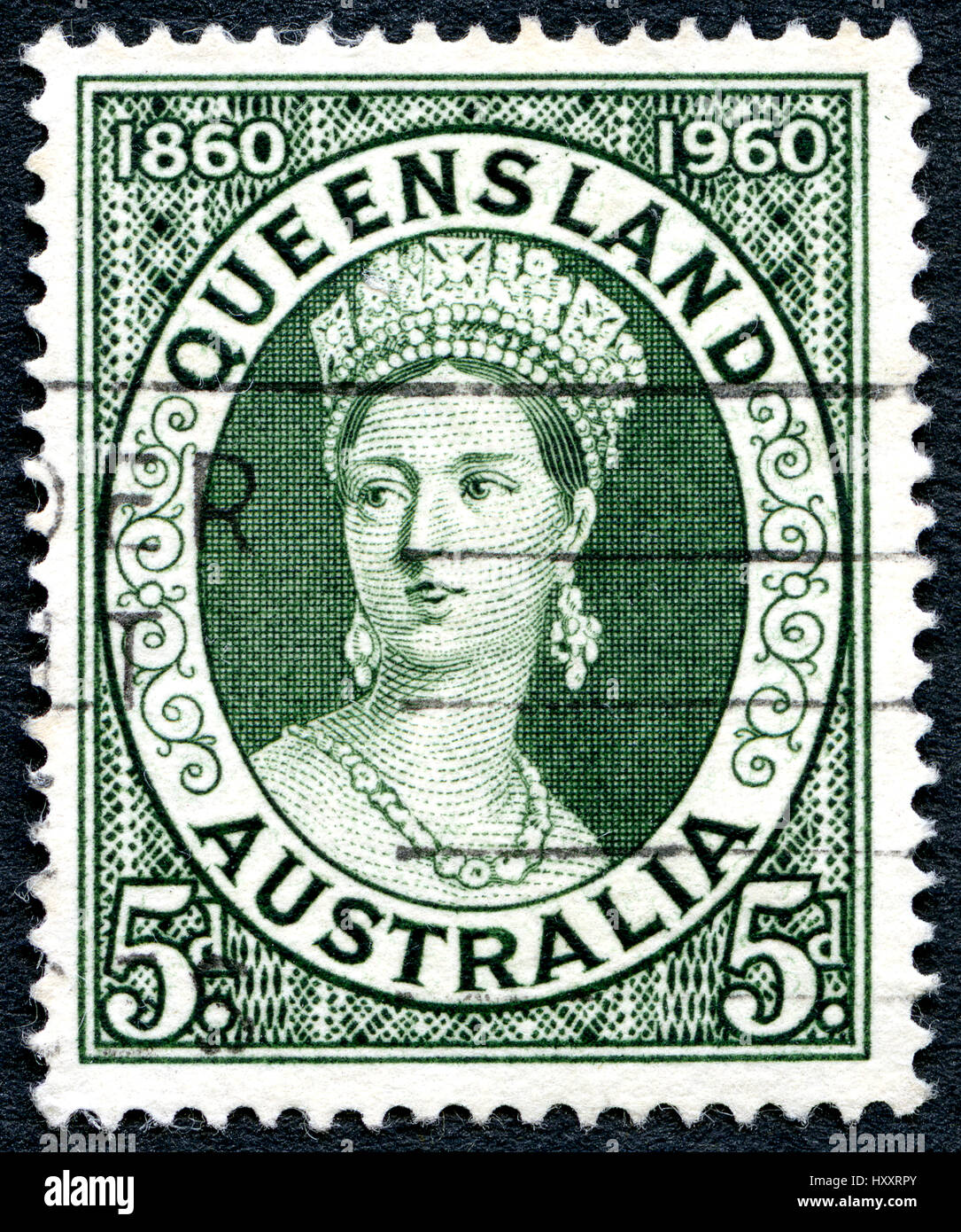 Australien - ca. 1960: Eine gebrauchte Briefmarke aus Australien, zeigt ein Porträt von Königin Victoria und zum Gedenken an die Hundertjahrfeier des Queensland pos Stockfoto