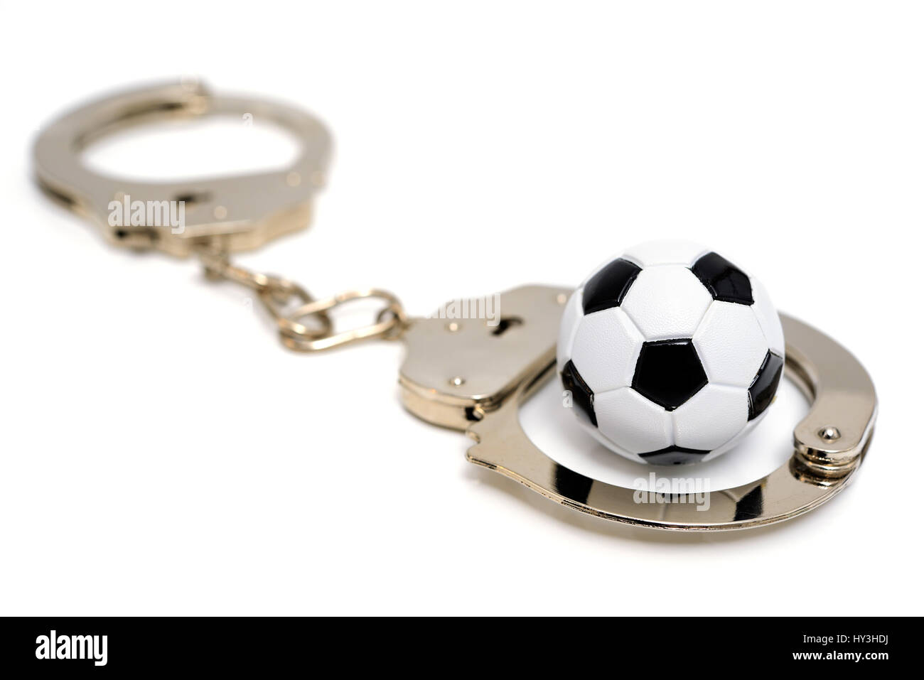 Handschellen und Mini-Fußball, DFB-Skandal, Handschellen Und Miniaturfußball, DFB-Skandal Stockfoto