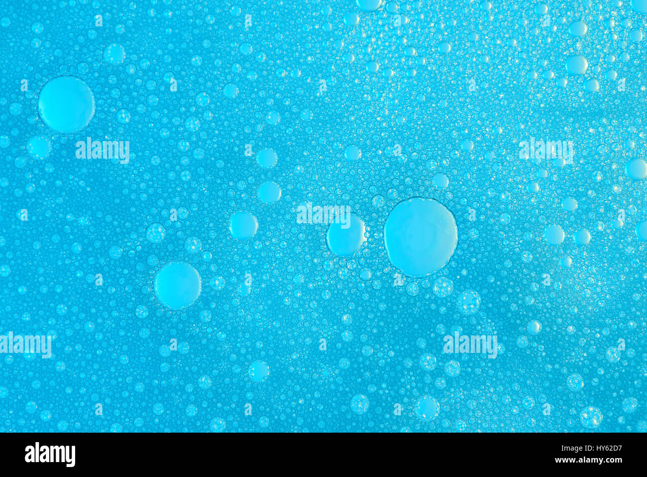 Waschen flüssige abstrakte Textur. Makro der blaue Seifenblasen Tapete Stockfoto