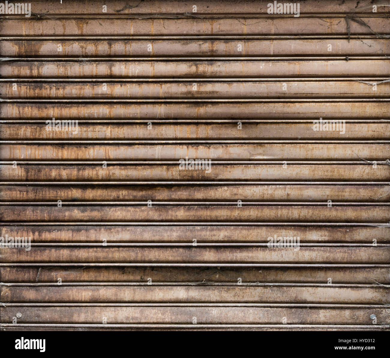 Grunge verwitterten metallische Roll up Tür. rusty Iron Gate. Stockfoto Grunge verwitterten metallische Roll up Tür. rusty Iron Gate. Stockfoto