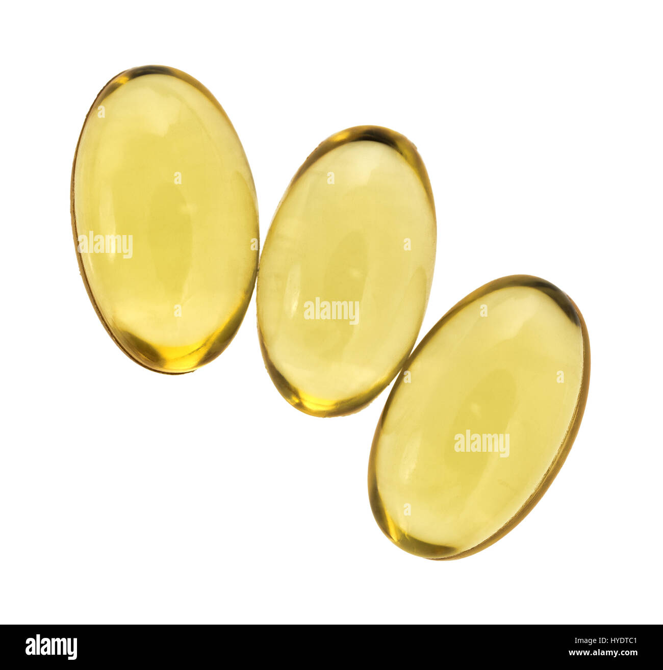 Draufsicht der drei Vitamin-A-Gel-Kapseln, die isoliert auf einem weißen Hintergrund. Stockfoto