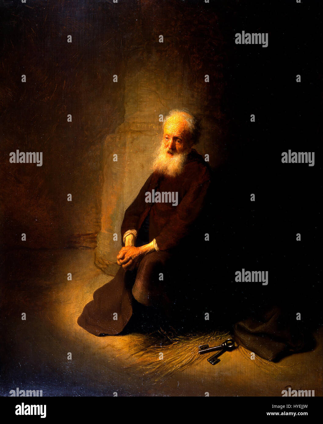 Rembrandts „St. Peter im Gefängnis“ zeigt die biblische Geschichte des Apostels Petrus im Gebet, während er inhaftiert war, und zeigt Rembrandts Beherrschung von Licht und Schatten, um die Emotionen der Szene hervorzuheben. Stockfoto