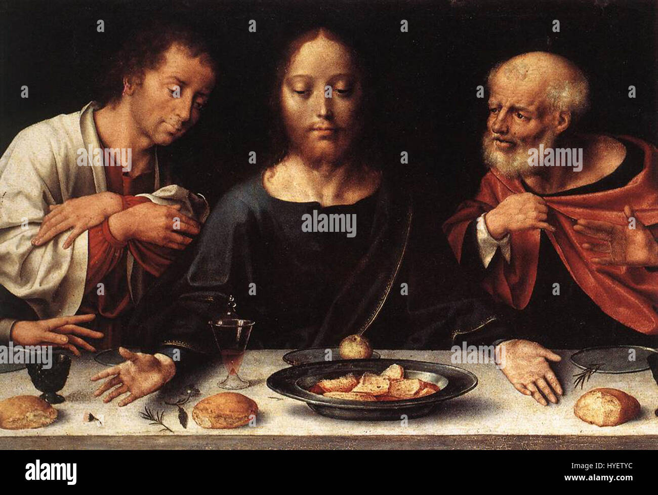 Das Altarstück der Klage von Joos van Cleve zeigt die Trauer um Christi Tod und konzentriert sich auf eine detaillierte Darstellung von Trauer und Emotionen. Das Gemälde ist Teil der flämischen Renaissance-Tradition, mit sorgfältiger Aufmerksamkeit auf religiöse Themen und Figuren. Stockfoto