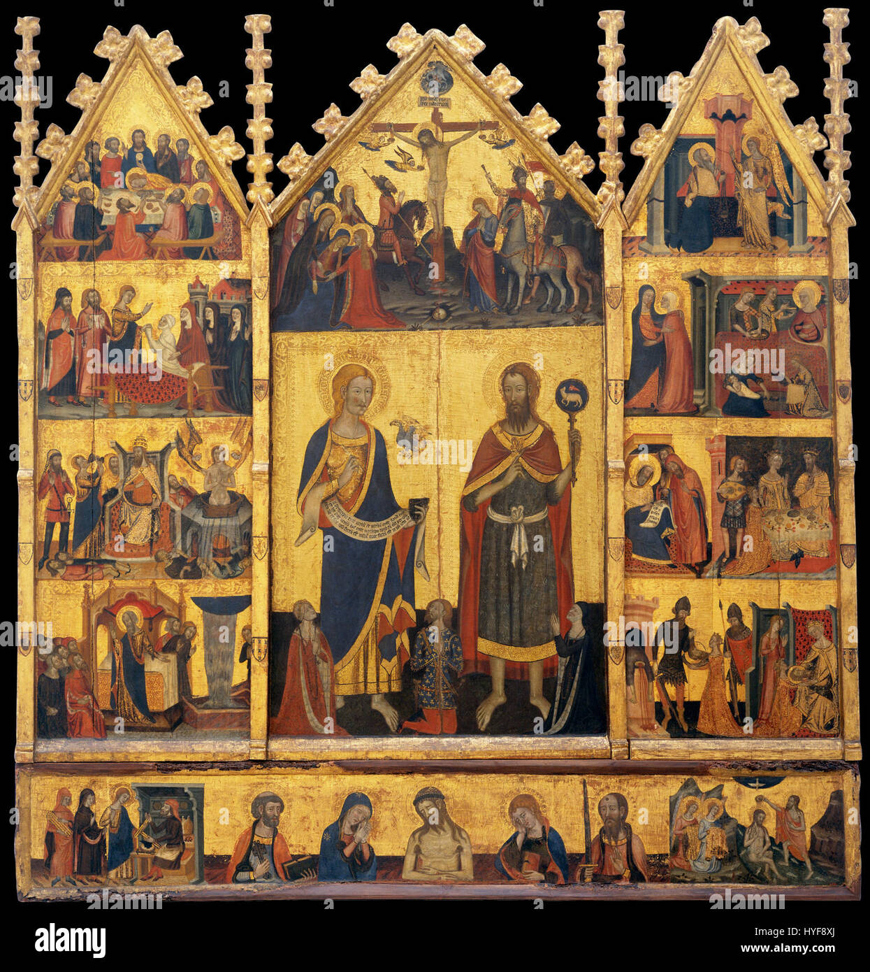 Das Altar der Heiligen Johannes, das dem Meister von Santa Coloma de Queralt zugeschrieben wird, ist ein detailliertes religiöses Kunstwerk, das das Leben des Heiligen Johannes des Täufers und des Heiligen Johannes des Evangelisten darstellt. Der Altaraufsatz ist bekannt für seine lebhaften Farben und seine komplizierten Golddetails. Stockfoto Das Altar der Heiligen Johannes, das dem Meister von Santa Coloma de Queralt zugeschrieben wird, ist ein detailliertes religiöses Kunstwerk, das das Leben des Heiligen Johannes des Täufers und des Heiligen Johannes des Evangelisten darstellt. Der Altaraufsatz ist bekannt für seine lebhaften Farben und seine komplizierten Golddetails. Stockfoto