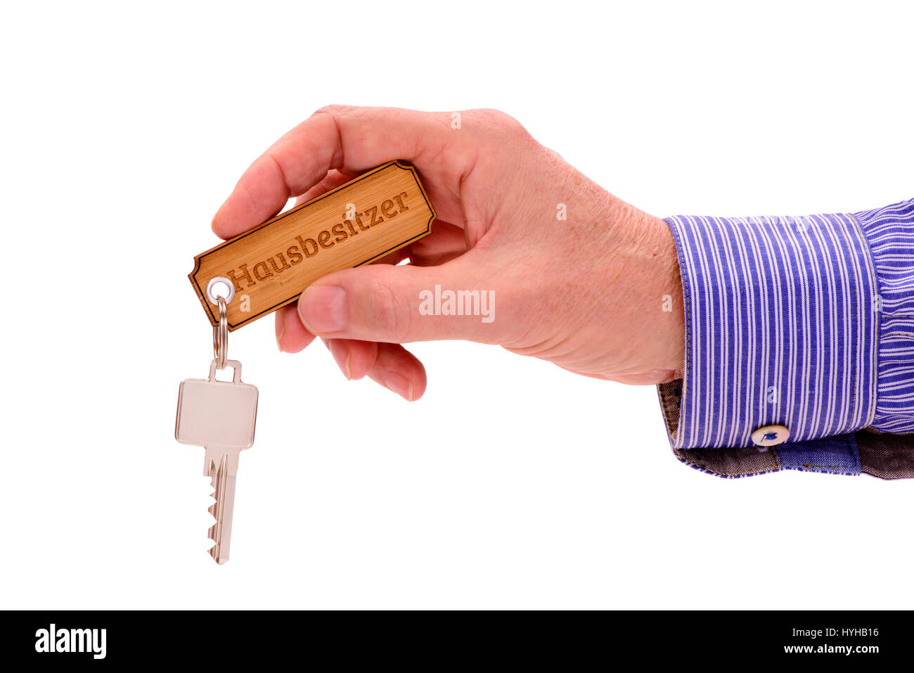 Hausschlüssel in der Hand der Immobilienmakler Stockfoto