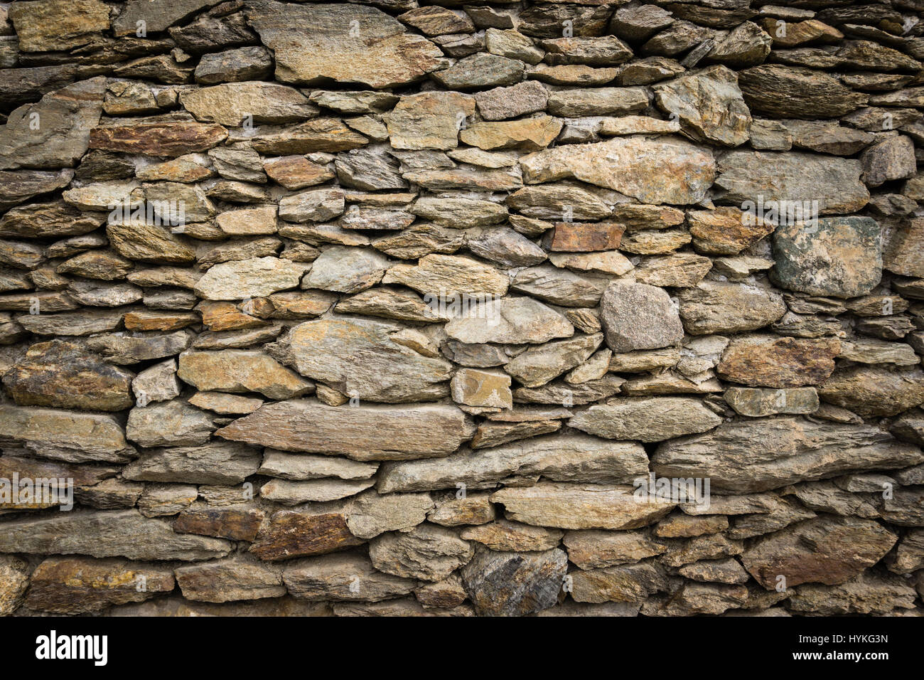 Trockenes Mauerwerk Felswand der natürlichen Steine mit schönen Vignettierung Stockfoto
