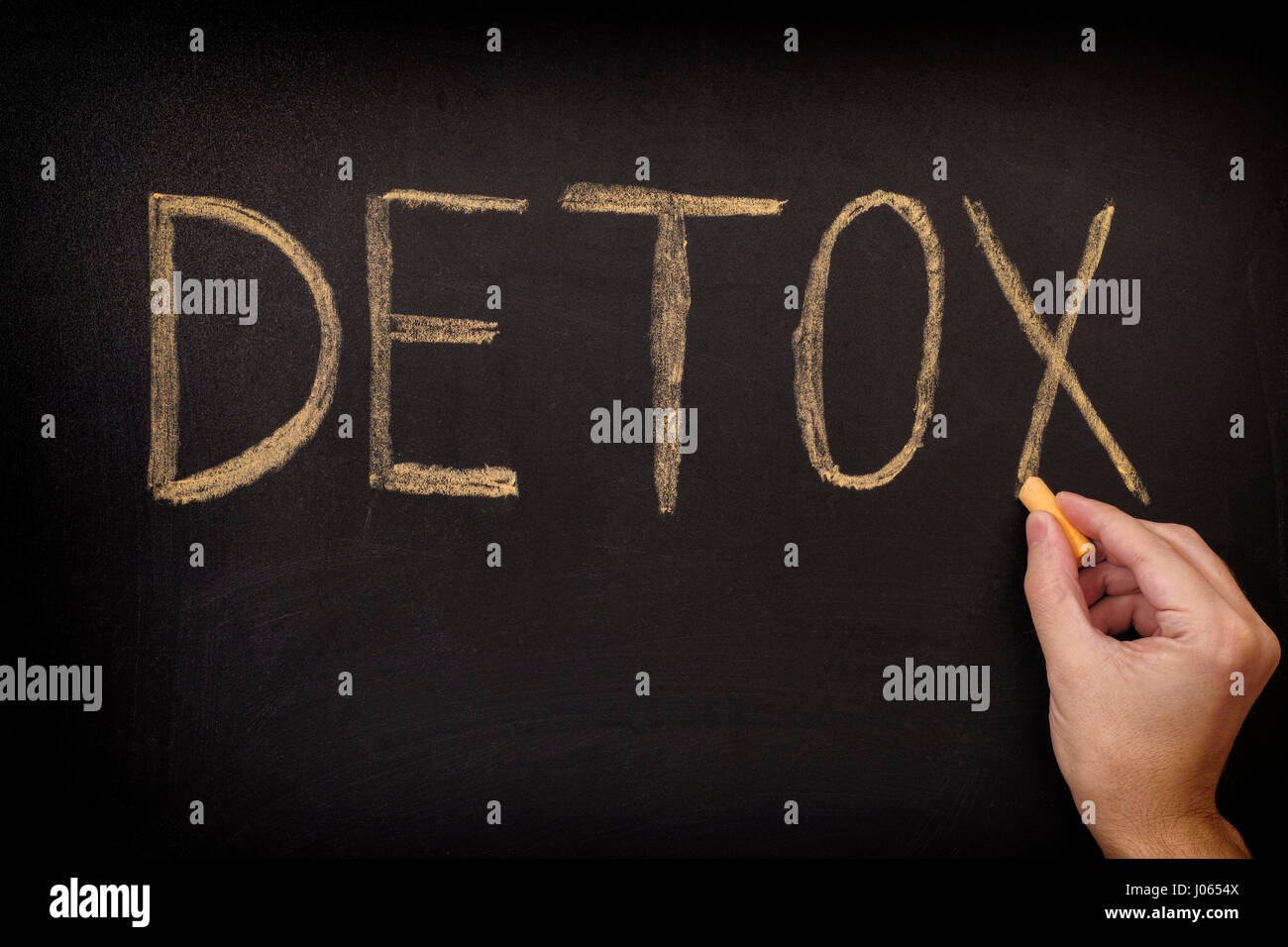 Handschrift Wort Detox an Tafel. Hautnah. Stockfoto