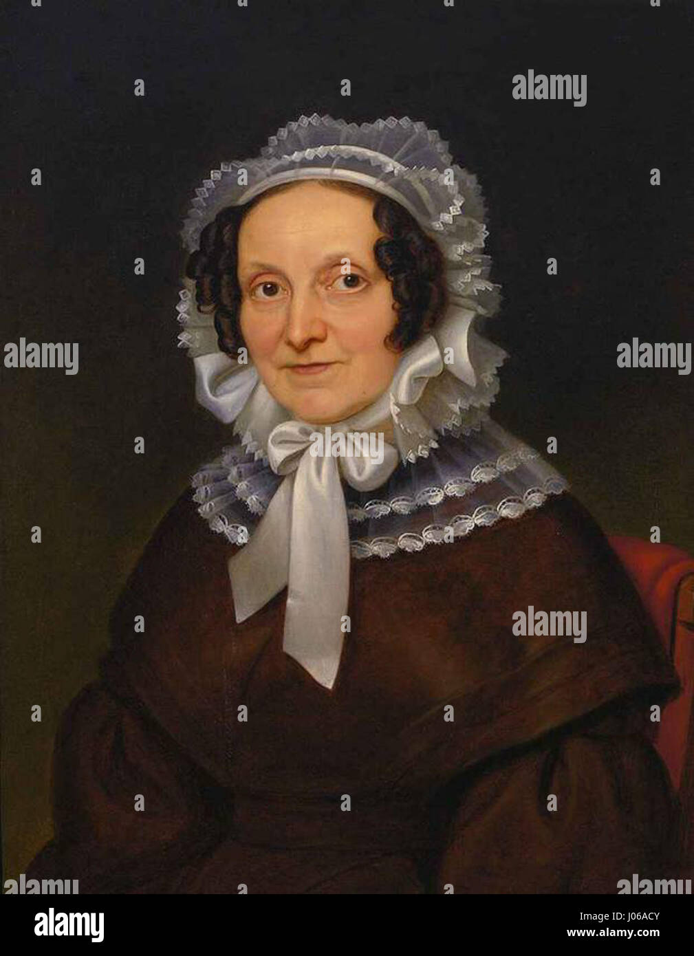 Das Porträt „Frau Hochstätter“ von Stirnbrand fokussiert auf die schicke Eleganz des Themas und fängt einen raffinierten, ruhigen Ausdruck ein. Das Gemälde veranschaulicht die Kunst des Künstlers, lebensechte Porträts mit feinen Details und subtiler Schattierung zu kreieren. Stockfoto