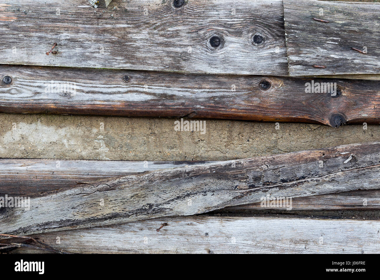 Neutralem Hintergrundwand verblasst der alten Bretter Stockfoto