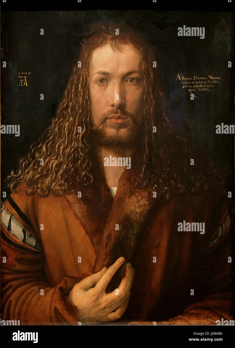 Albrecht Dürers Selbstbildnis im Pelzrock aus dem Jahr 1500 zeigt den detaillierten Gesichtsausdruck und die Beherrschung der Selbstdarstellung des Künstlers und unterstreicht seinen Status als Renaissance-Künstler. Stockfoto