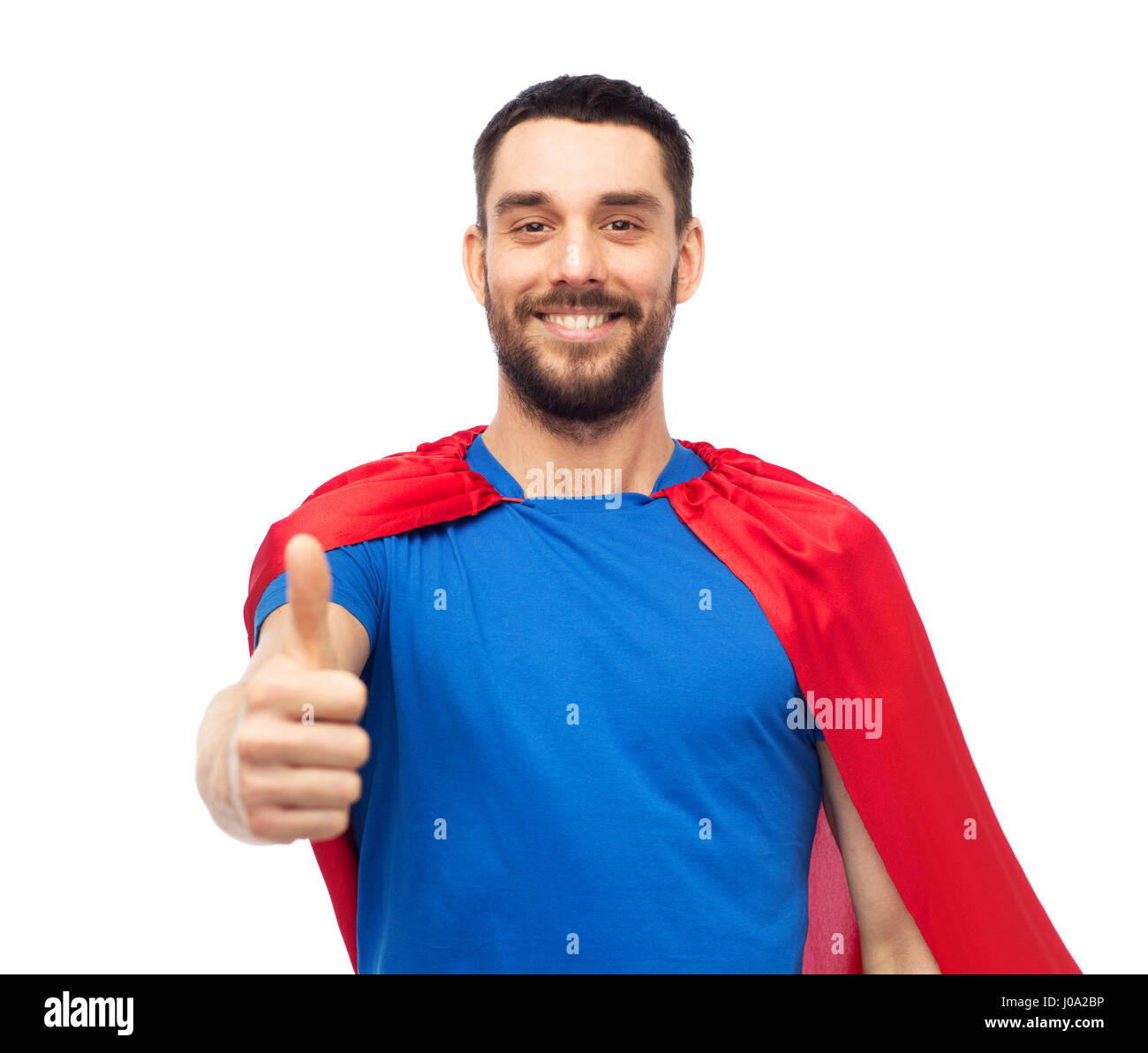 glücklicher Mann im roten Superhelden Cape Daumen auftauchen Stockfoto