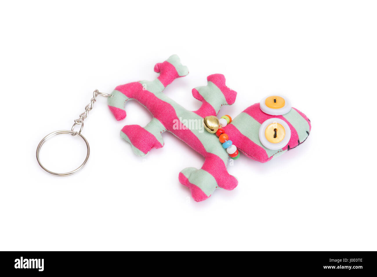 Handgefertigte niedliche Gecko Schlüsselanhänger auf weißem Hintergrund. Stockfoto