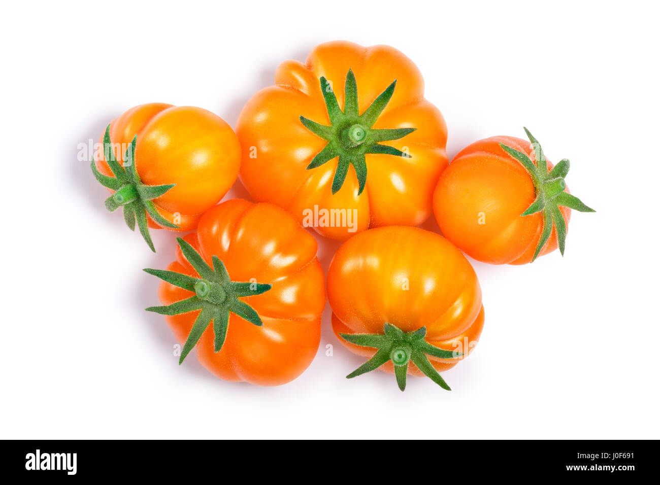 Gelbe gerippte Heirloom Tomaten (Solanum Lycopersicum var. Togorific). Schneidepfade, Schatten getrennt, Top Aussicht Stockfoto