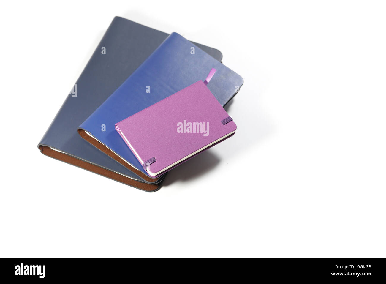 Notebooks, die isoliert auf weißem Hintergrund Stockfoto